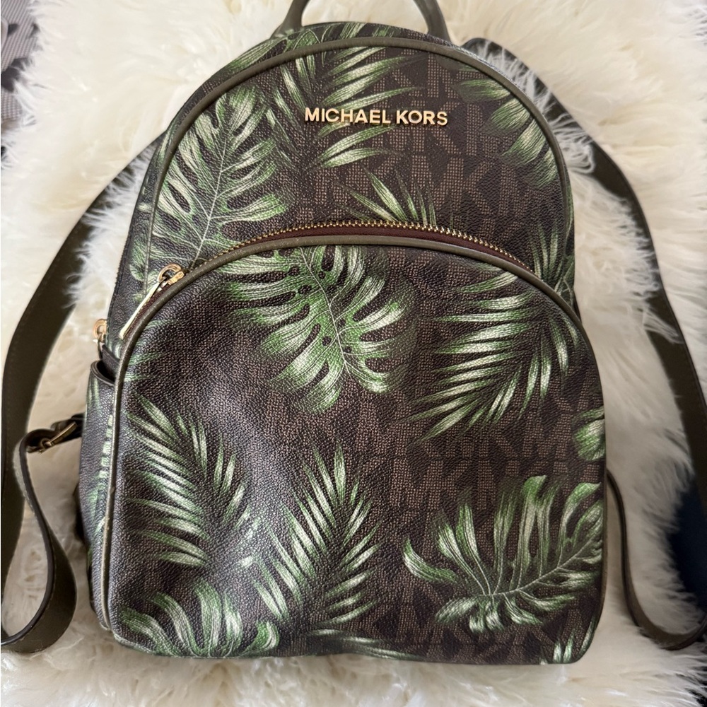Michael Kors woman’s Backpack with Green Leaf Design.
Used good condition